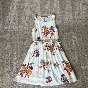 Floral white and orange dress size small with tie belt and flowy bottom EUC
